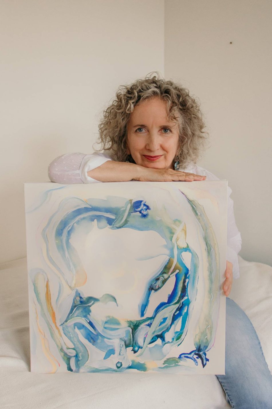 Teresa Doyle posing with her painting